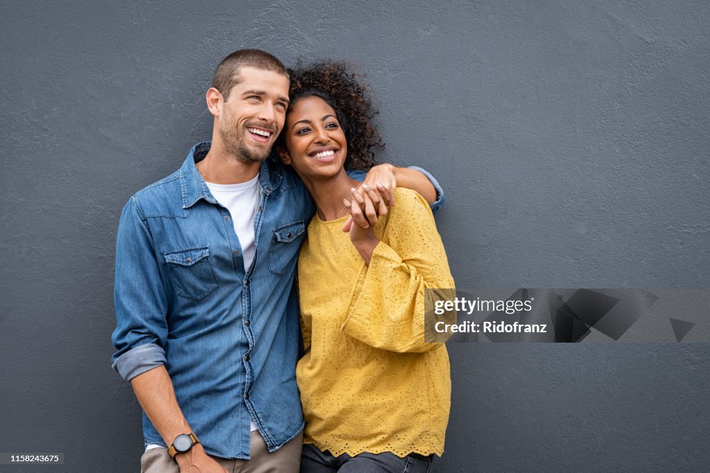 Multiethnic couple in love standing and holding hands