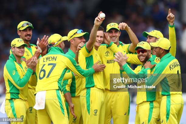 Jason Behrendorff of Australia holds up the ball after taking 5 wickets for 44 runs during the Group Stage match of the ICC Cricket World Cup 2019...