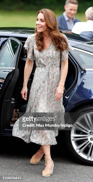 Catherine, Duchess of Cambridge joins a photography workshop for Action for Children, run by the Royal Photographic Society, at Warren Park on June...