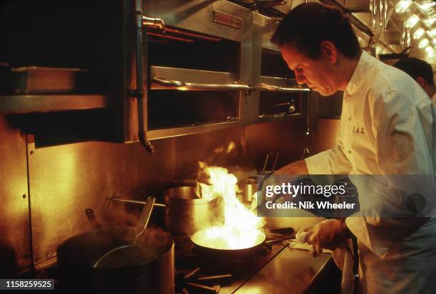 Renowned American chef Thomas Keller at work in the kitchen of hotel restaurant in Los Angeles California USA circa 1995: