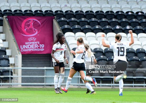 Nicole Anyomi of Germany celebrates with her team mates after scoring the opening goal of the game during the UEFA Women's Under19 European...