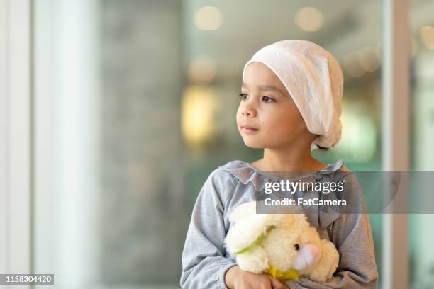 portrait of a young ethnic girl with cancer - illness hospital stock pictures, royalty-free photos & images