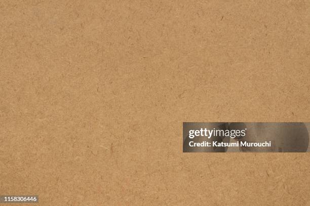 fiber brown paper textured background - bordpapier stockfoto's en -beelden