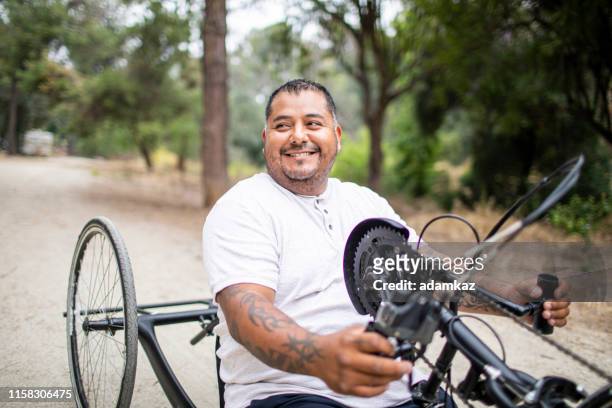 Mature Hispanic Man Riding Handcycle