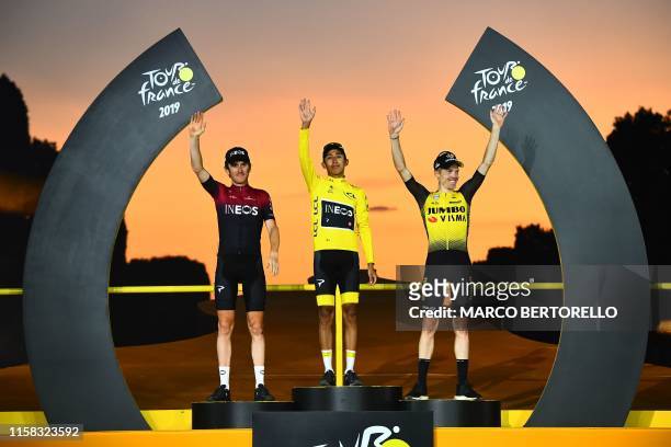 Colombia's Egan Bernal celebrates his overall leader's yellow jersey as he poses with second-placed Great Britain's Geraint Thomas and third-placed...