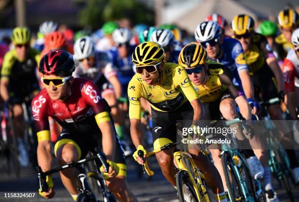 Egan Bernal, 2nd left, of Colombia competes on the Champs-Elysees avenue during the Paris Champs-Elysees stage of the Tour de France 2019 in Paris,...