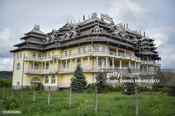 Palace belonging to a member of the Romanian Roma community is pictured in Buzescu village, southern Romania, on July 11, 2019. - In Romania's fields...