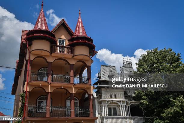 Palaces belonging to Romanian Roma people are pictured in Buzescu village, southern Romania, on July 11, 2019. - In Romania's fields or on the...