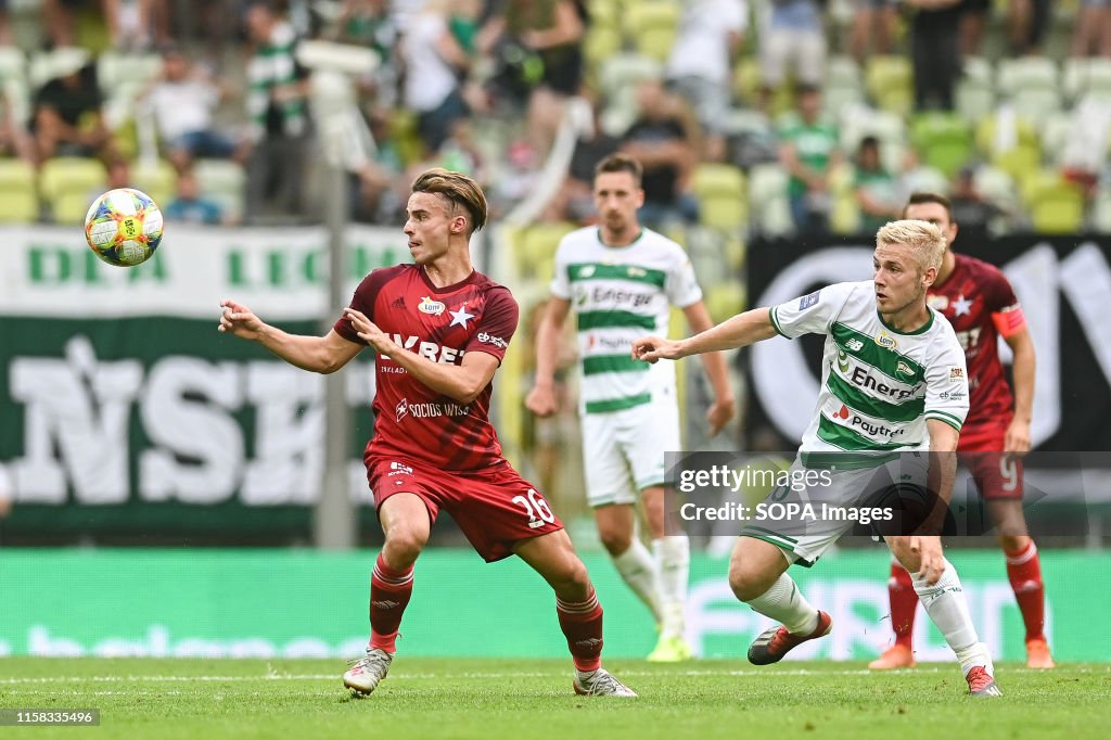 Kamil Wojtkowski from Wisla Krakow (L) and Tomasz Makowski...
