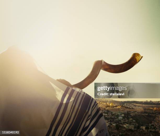 jewish man blowing the shofar in jerusalem - suffrage movement stock pictures, royalty-free photos & images