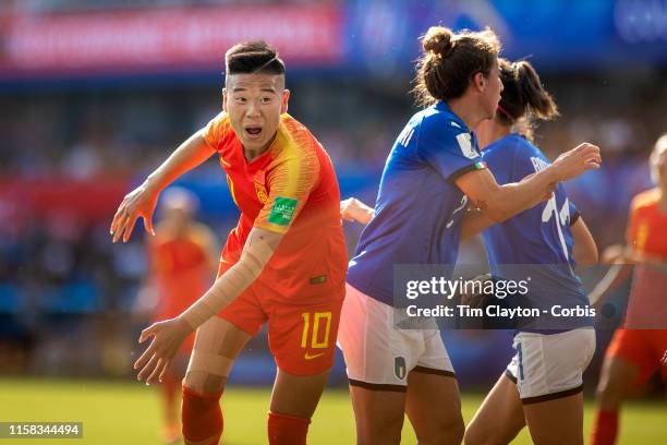 June 25. Li Ying of China heads goal wards past Valentina Bergamaschi of Italy during the Italy V China, round of sixteen match at the FIFA Women's...