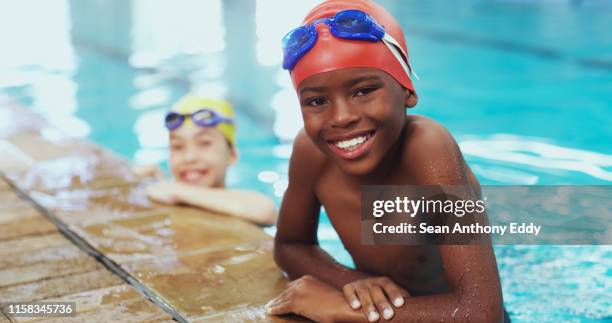confident swimmers are safe swimmers - boy swimming pool stock pictures, royalty-free photos & images