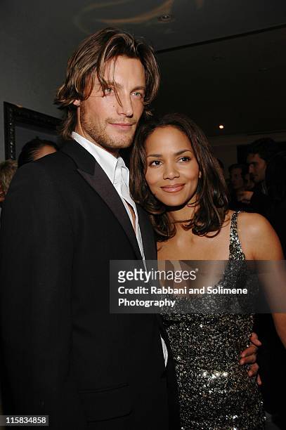 Gabriel Aubry and Halle Berry during Versace Celebrates the Re-Opening of the Fifth Ave. Boutique at Versace Boutique in New York City, New York,...