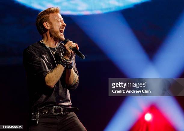 Canadian singer Corey Hart performs on stage at Rogers Arena on June 25, 2019 in Vancouver, Canada.
