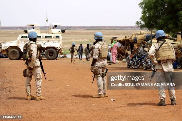 Senegalese soldiers of the UN peacekeeping mission in Mali MINUSMA patrol on foot in the streets of Gao, on July 24 a day after suicide bombers in a...