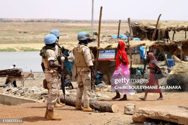 Senegalese soldiers of the UN peacekeeping mission in Mali MINUSMA patrol on foot in the streets of Gao, on July 24 a day after suicide bombers in a...