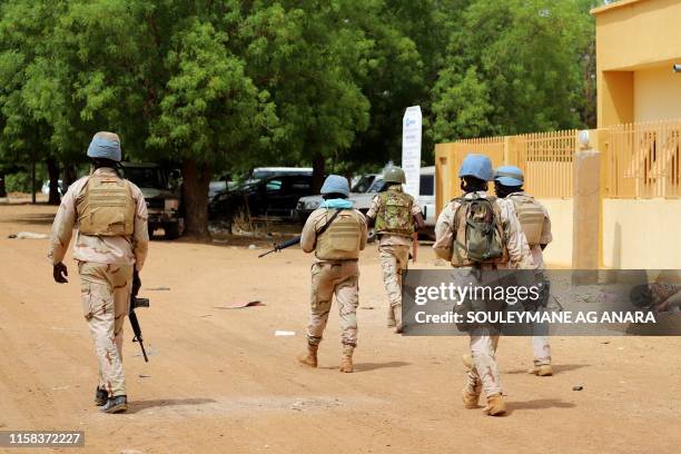 Senegalese soldiers of the UN peacekeeping mission in Mali MINUSMA patrol on foot in the streets of Gao, on July 24 a day after suicide bombers in a...