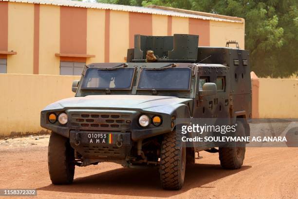 Vehicle of the FAMA patrols in the streets of Gao, on July 24 a day after suicide bombers in a vehicle painted with UN markings injured one French,...