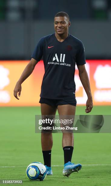 Kylian Mbappe of Paris Saint-Germain in action during the training session at Suzhou Olympic Sports Center Stadium one day before their match against...