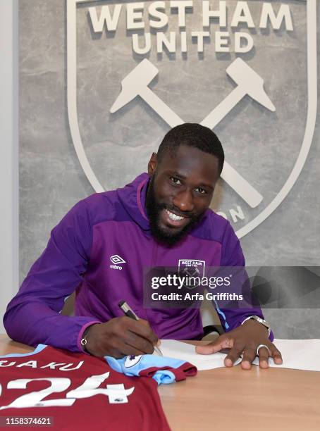 Arthur Masuaku of West Ham United signs a contract extension until 2024 at Rush Green Training Ground on July 29, 2019 in Romford, England.