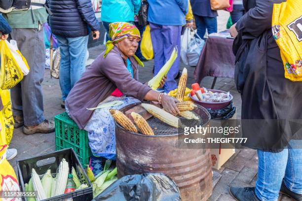 senior lady selling mielies on the street in fordsburg, johannesburg - gauteng province stock pictures, royalty-free photos & images