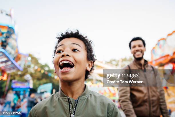 young boy having a great time at fun fair - festival day 11 fotografías e imágenes de stock