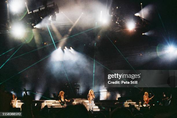 Vivian Campbell, Rick Savage, Rick Allen , Joe Elliot and Phil Collen of Def Leppard perform on stage with laser light stage effects at The Don...
