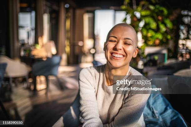 portrait of a smiling girl with short hair - short hair stock pictures, royalty-free photos & images