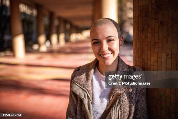 portrait of a smiling girl with short hair - girl short hair stock pictures, royalty-free photos & images