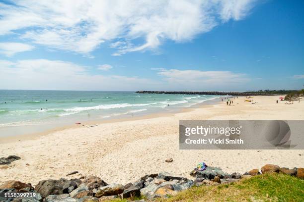 beautiful sandy beach, ocean and blue sky's - newcastle new south wales stock pictures, royalty-free photos & images