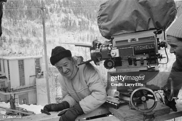 American actor and film director Anthony Mann and a camera operator on the set of war film 'The Heroes of Telemark', Norway, 20th January 1965.