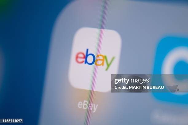 This illustration picture taken on July 24, 2019 in Paris shows the logo of the US web auctions application Ebay on the screen of a tablet.