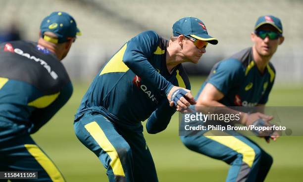 David Warner and Cameron Bancroft watch Steve Smith of Australia take a catch during a training session before the first Specsavers Test Match...