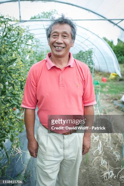 Asafumi Yamashita poses during portrait session in his farm "La Ferme Yamashita" on July 28, 2019 in Chapet near Aubergenville, France.