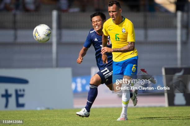 June 15. Reo Hatate of Japan and Iago of Brazil challenge for the ball during the Brazil U22 V Japan U22 Final match at the Tournoi Maurice Revello...