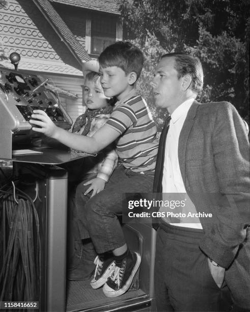 On set of the CBS television rural comedy, The Andy Griffith Show. Left to right, the boys / brothers Clint Howard, Ron Howard with father Rance...