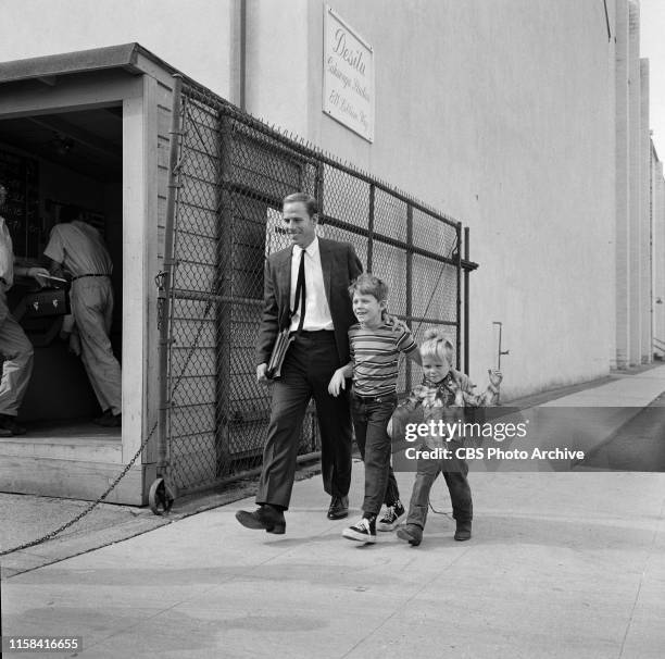 On set of the CBS television rural comedy, The Andy Griffith Show. Left to right, Rance Howard, father to the two boys / brothers Ron Howard and...