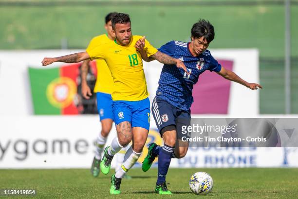 June 15. Matheus Henrique of Brazil and Kaoru Mitoma of Japan challenge for the ball during the Brazil U22 V Japan U22 Final match at the Tournoi...