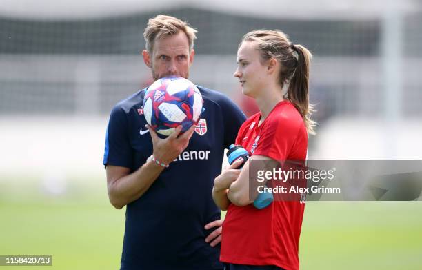 Head coach Martin Sjogren talks to Caroline Graham Hansen during a Norway training session during the FIFA Women's World Cup France 2019 at Stade...