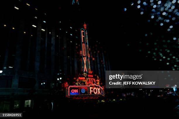 The Fox Theatre, shot through a rain soaked car window, in Detroit on July 29, 2019 in Detroit, Michigan. - Democrat presidential candidates will...