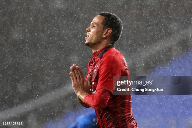 Ewerton of Urawa Red Diamonds celebrates scoring his side's third goal during the AFC Champions League round of 16 second leg match between Ulsan...