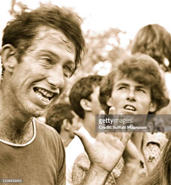 Man possibly on drugs and a young man with curly hair at the 1st Elysian Park Love-In on March 26, 1967 in Los Angeles, California.