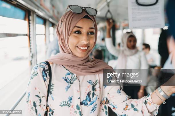 friends talking together inside a bus in the city - north african culture stock pictures, royalty-free photos & images