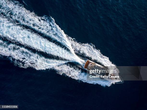 aerial of a luxury motor yacht - segeljacht stock-fotos und bilder