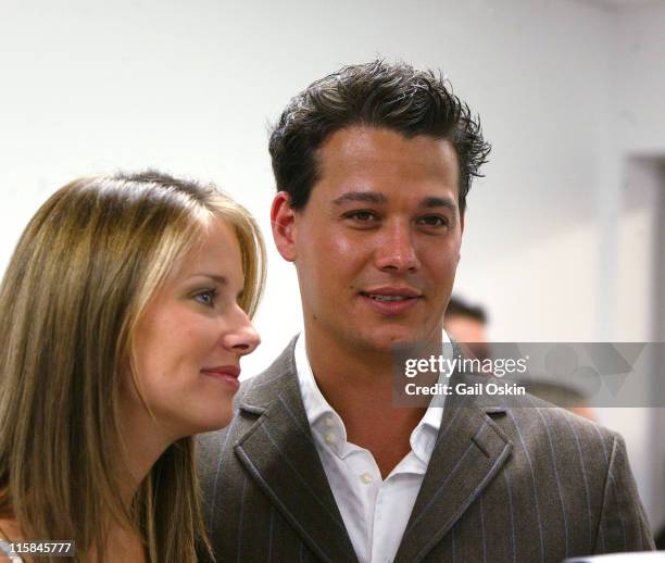 Amber Brkich and Rob Mariano wearing H Hilfiger during Tommy Hilfiger Fashion Show Presented by Macy's at Macy's Downtown Crossing in Boston,...