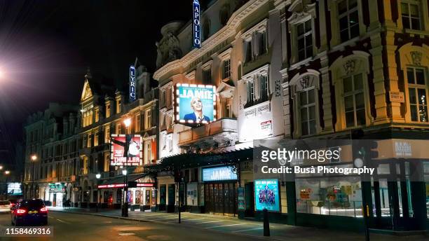 the apollo theatre and the lyric theater in the west end on shaftesbury avenue in the city of westminster, in central london, england - theatre building stockfoto's en -beelden