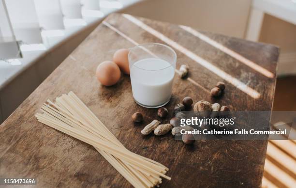 eggs, pasta, nuts and milk - celiac disease stock pictures, royalty-free photos & images