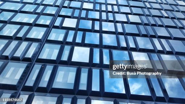 modern glass facade of "the corner", a new mixed-use building in the porta nuova district of milan, italy - corner marking imagens e fotografias de stock