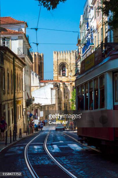tram remodeled in the castelo neighborhood in lisbon, portugal - baixa stock-fotos und bilder