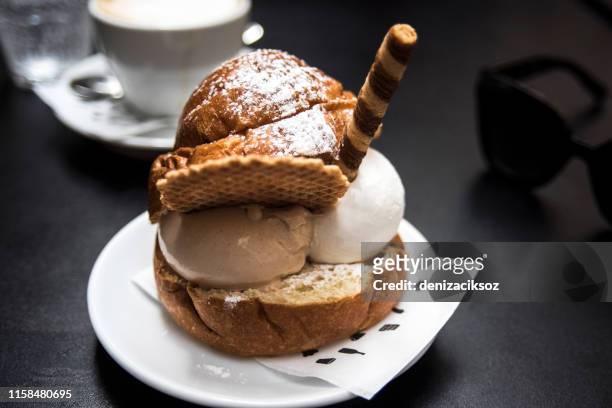 artisan preparation of classic sweet bun, with ice cream gelato. image of two flavor ice cream bun with coffee - waffles stock pictures, royalty-free photos & images